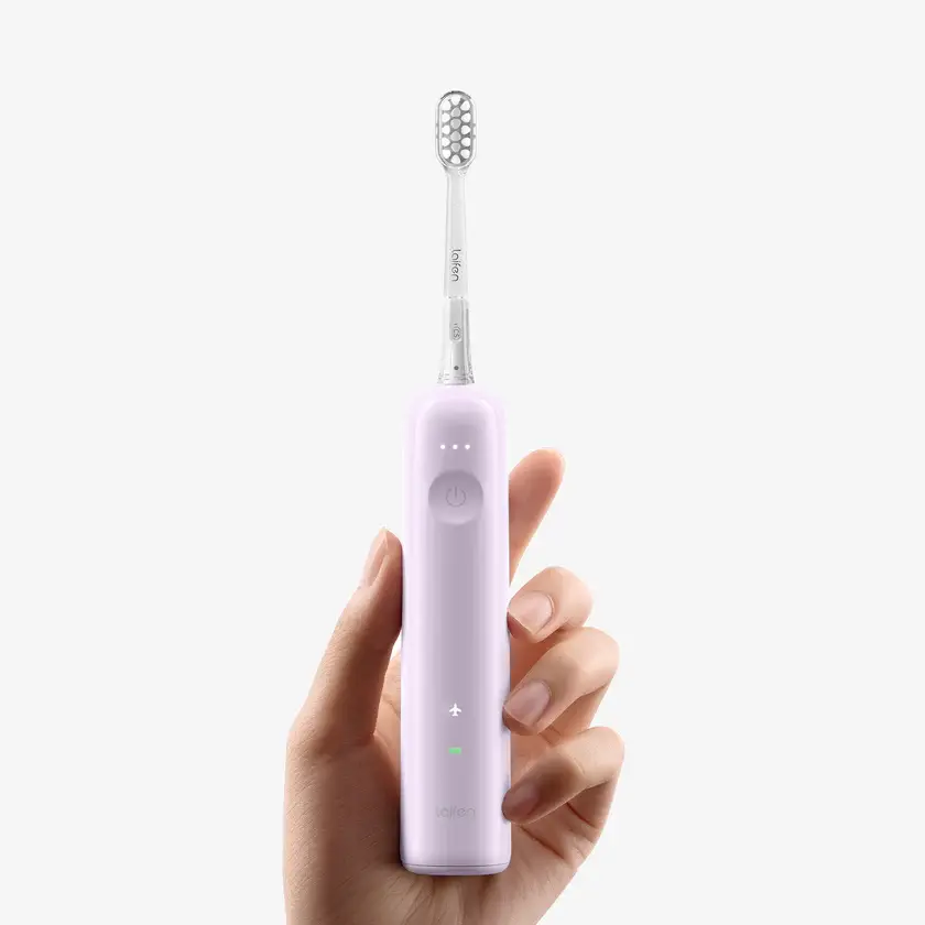 wave-electric-toothbrush-abs-purple-mode-front-view-handheld.webp